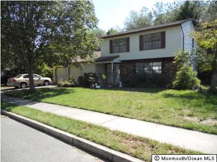25 Hedgewood Road Howell, NJ 07731 - Photo 1 of 3 a view of a house with a yard and large tree