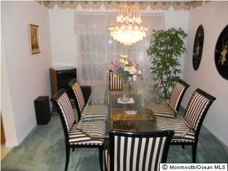 25 Hedgewood Road Howell, NJ 07731 - Photo 2 of 3 a view of a dining room with furniture and chandelier