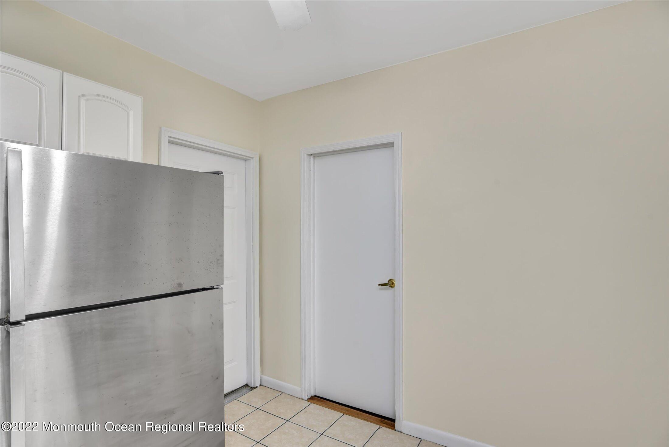 742 Old Road Elizabeth, NJ 07202 - Photo 12 of 25 a view of a refrigerator in kitchen and white cabinets