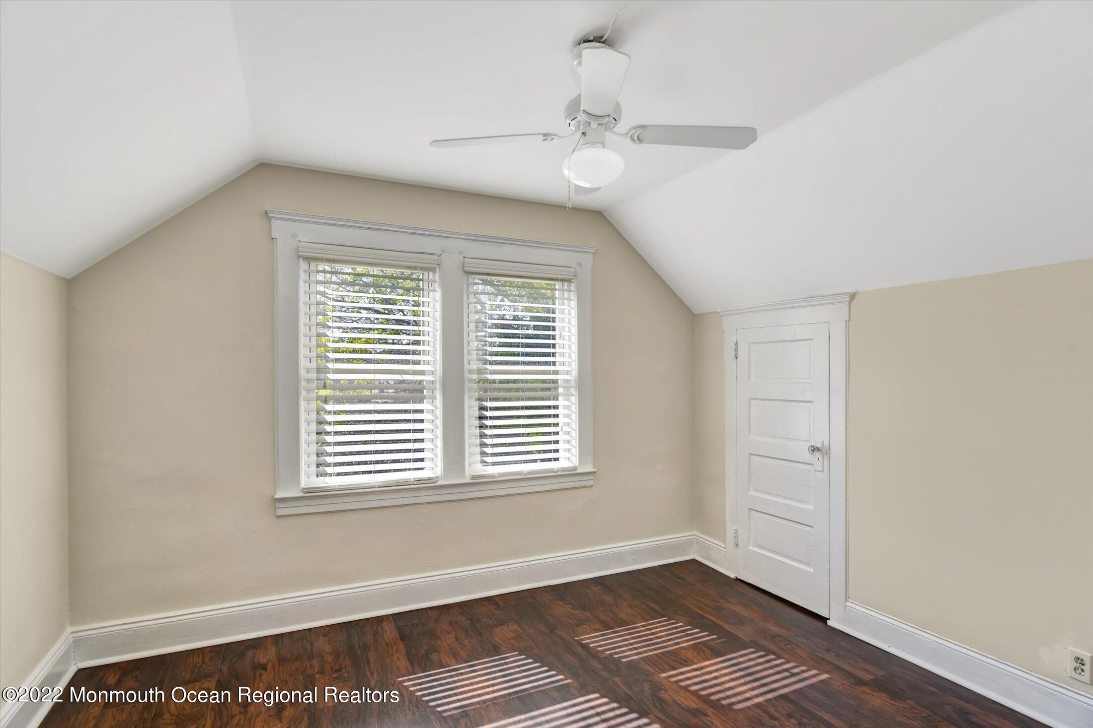 742 Old Road Elizabeth, NJ 07202 - Photo 19 of 25 a view of an empty room with a window and wooden floor