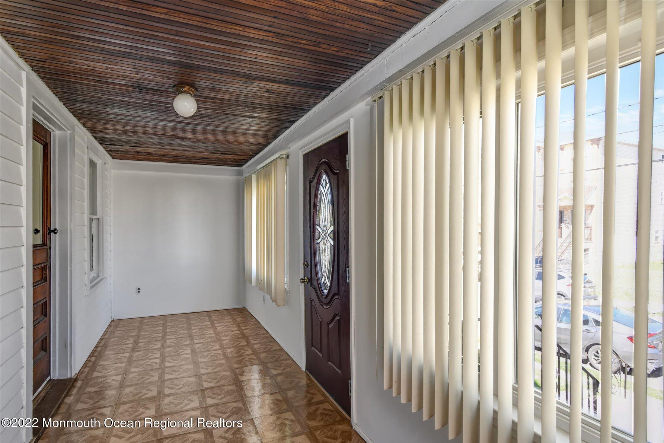 742 Old Road Elizabeth, NJ 07202 - Photo 3 of 25 a view of hallway with wooden floor and stairs