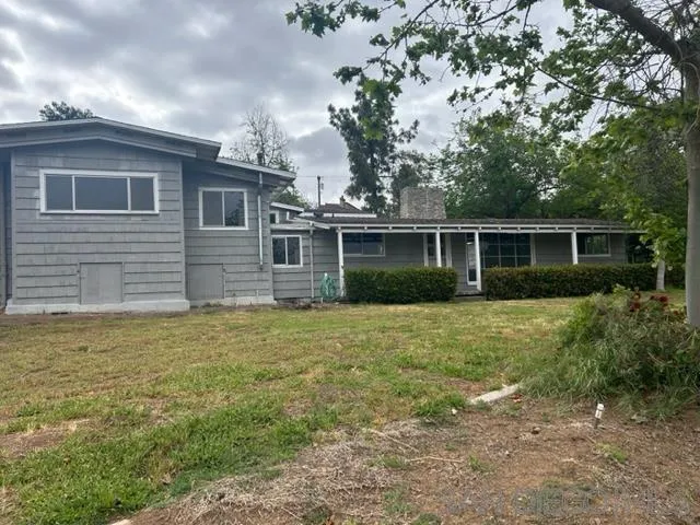 1637 Grove Road El Cajon, CA 92020 - Photo 1 of 2 a backyard of a house with plants and garden