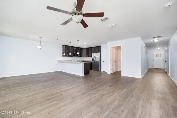 a kitchen with granite countertop stainless steel appliances and wooden cabinets