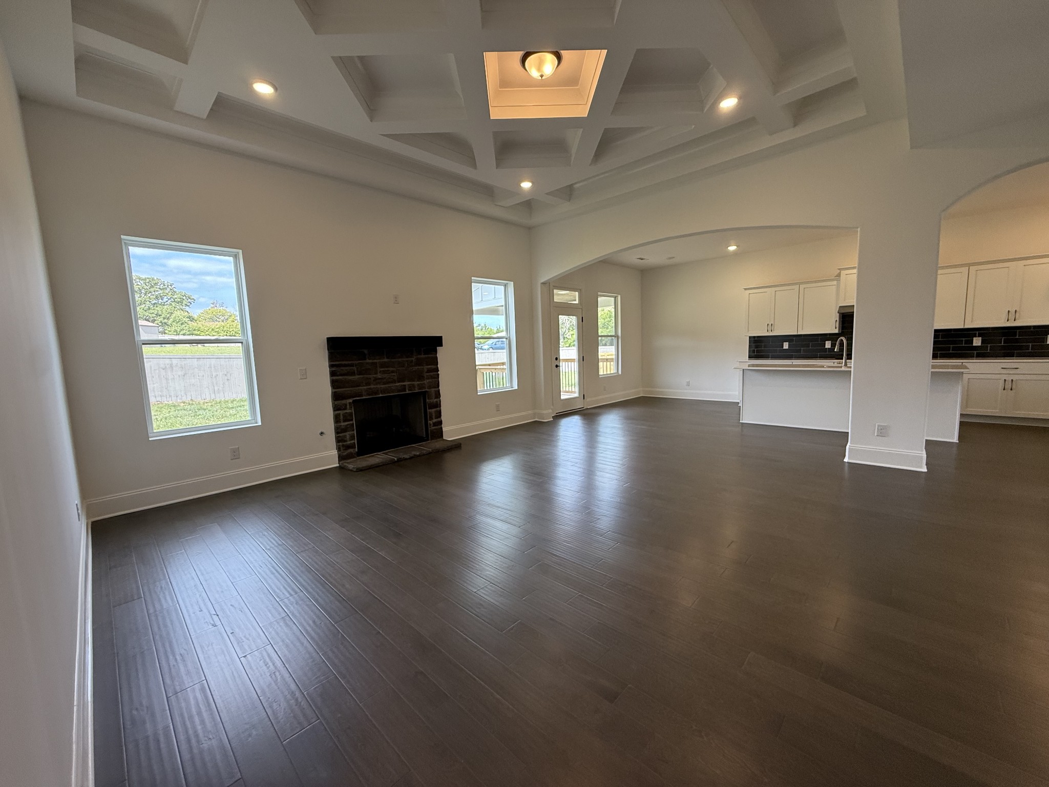 2115 Harkreader Road Mount Juliet, TN 37122 - Photo 17 of 21 an empty room with a fireplace and wooden floor