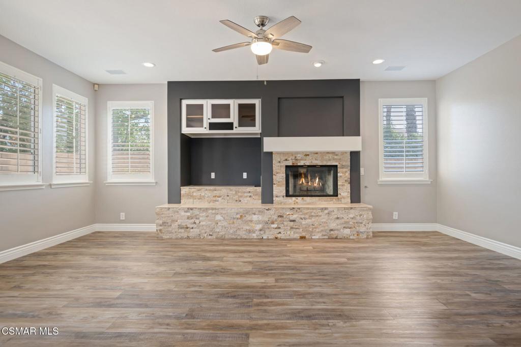 335 Kitetail Street Simi Valley, CA 93065 - Photo 11 of 55 a view of empty room with wooden floor and fireplace