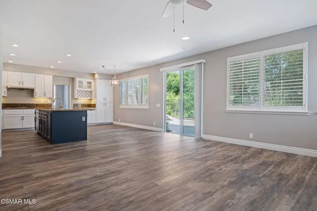 a view of kitchen with furniture and wooden floor