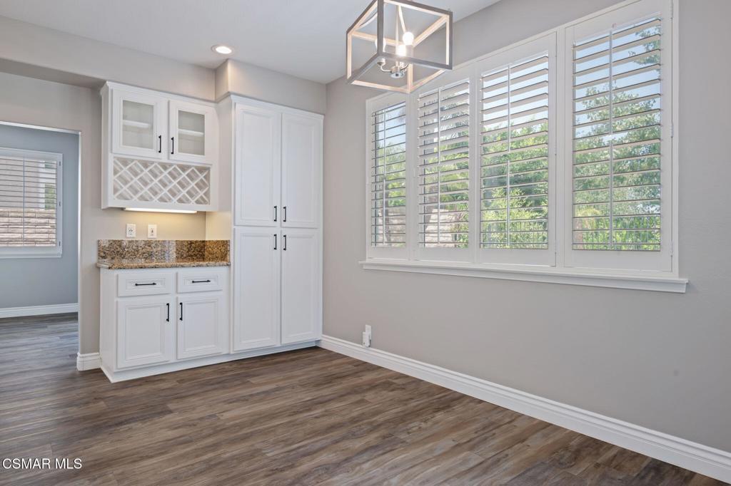 335 Kitetail Street Simi Valley, CA 93065 - Photo 19 of 55 a view of a kitchen with wooden floors and white walls