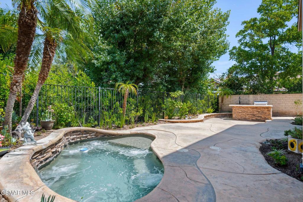 335 Kitetail Street Simi Valley, CA 93065 - Photo 22 of 55 a backyard of a house with table and chairs