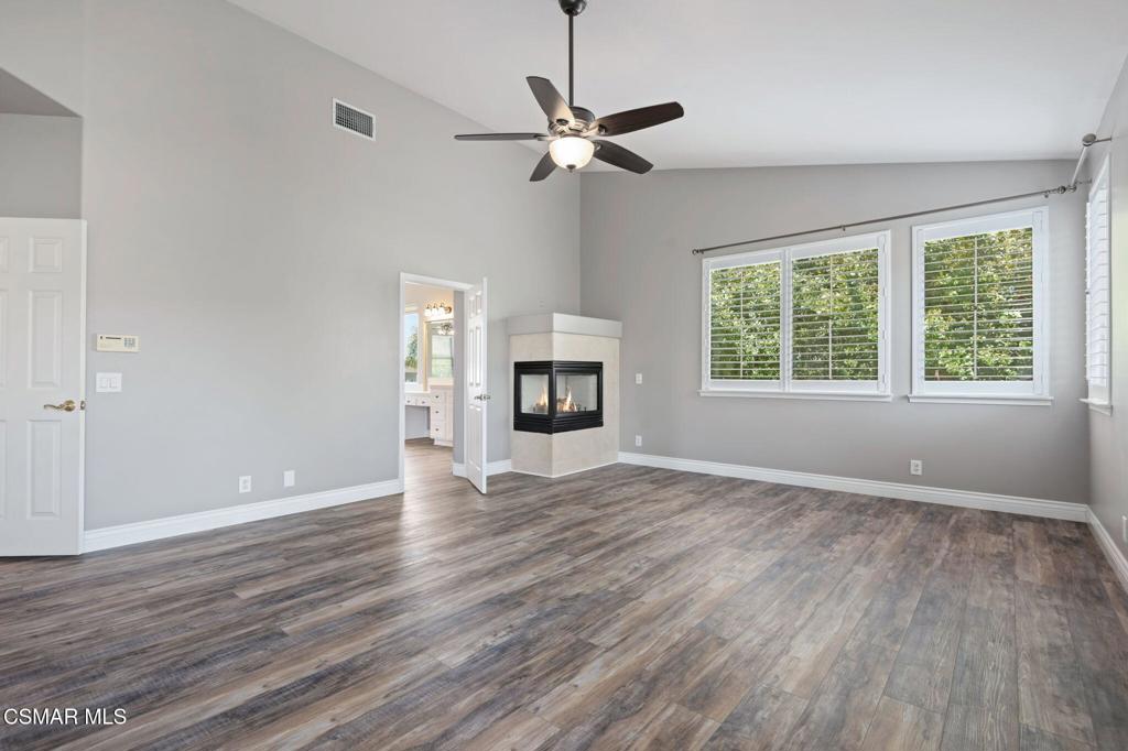 335 Kitetail Street Simi Valley, CA 93065 - Photo 28 of 55 a view of an empty room with wooden floor and a window