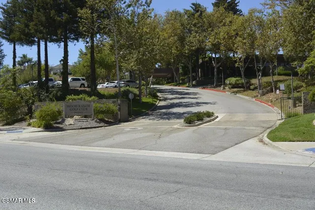 an aerial view of a residential houses with outdoor space