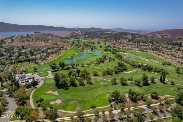 an aerial view of residential houses and outdoor space