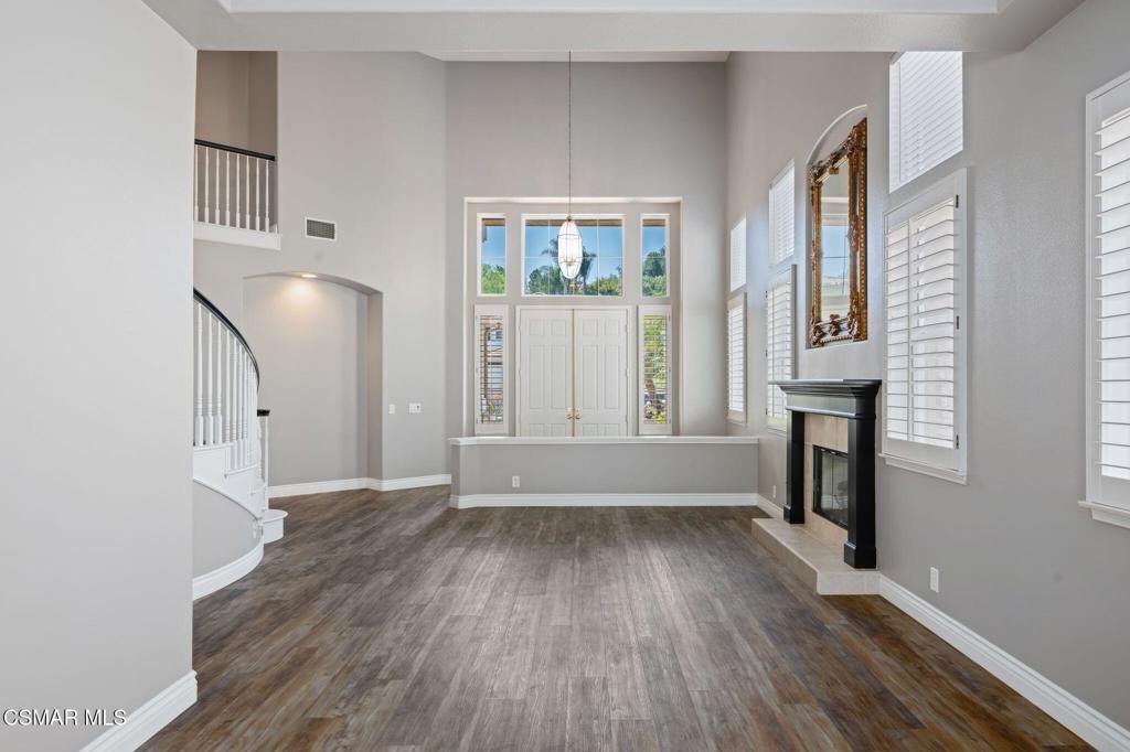 335 Kitetail Street Simi Valley, CA 93065 - Photo 9 of 55 an empty room with wooden floor and windows