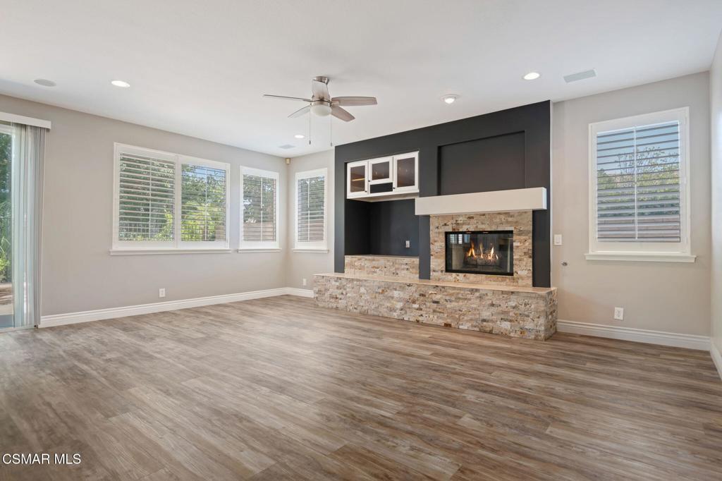 335 Kitetail Street Simi Valley, CA 93065 - Photo 10 of 55 a view of an empty room with a fireplace and a window
