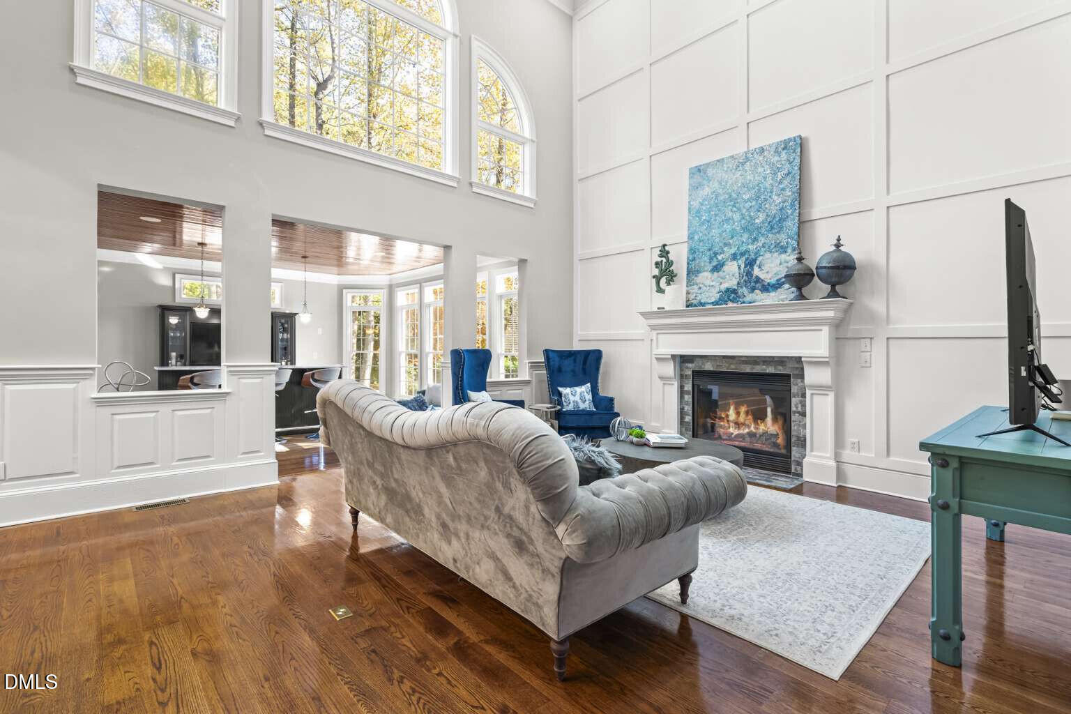 12452 Richmond Run Drive Raleigh, NC 27614 - Photo 14 of 73 a living room with furniture a fireplace and a table
