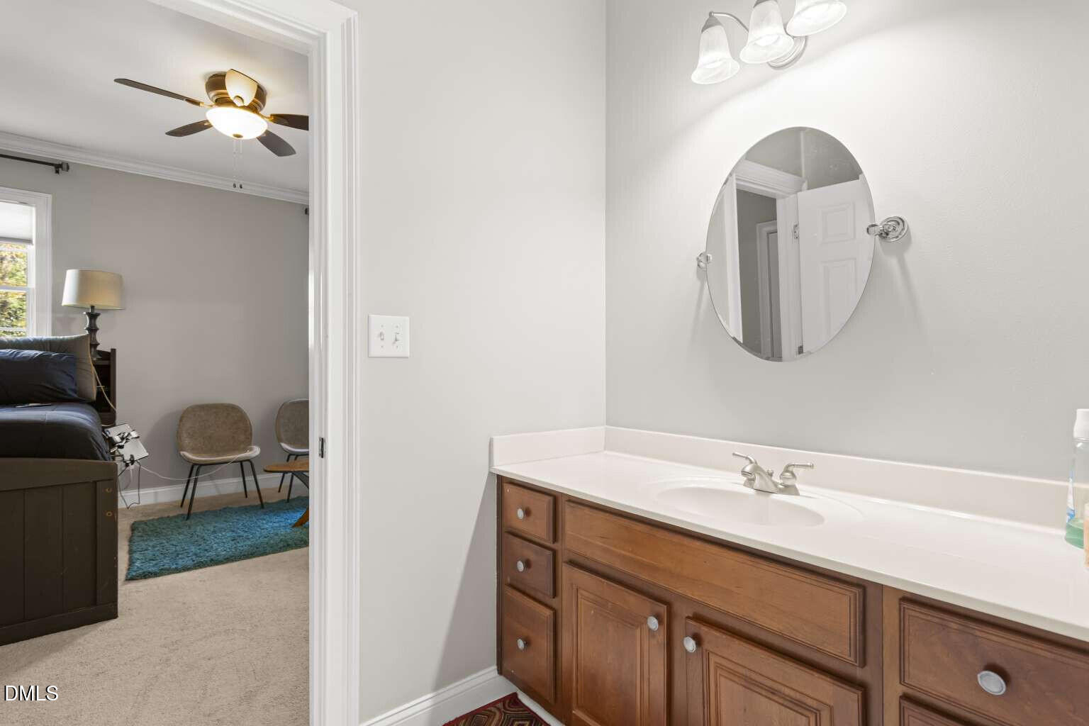 12452 Richmond Run Drive Raleigh, NC 27614 - Photo 49 of 73 a en suite bathroom with a sink and a mirror