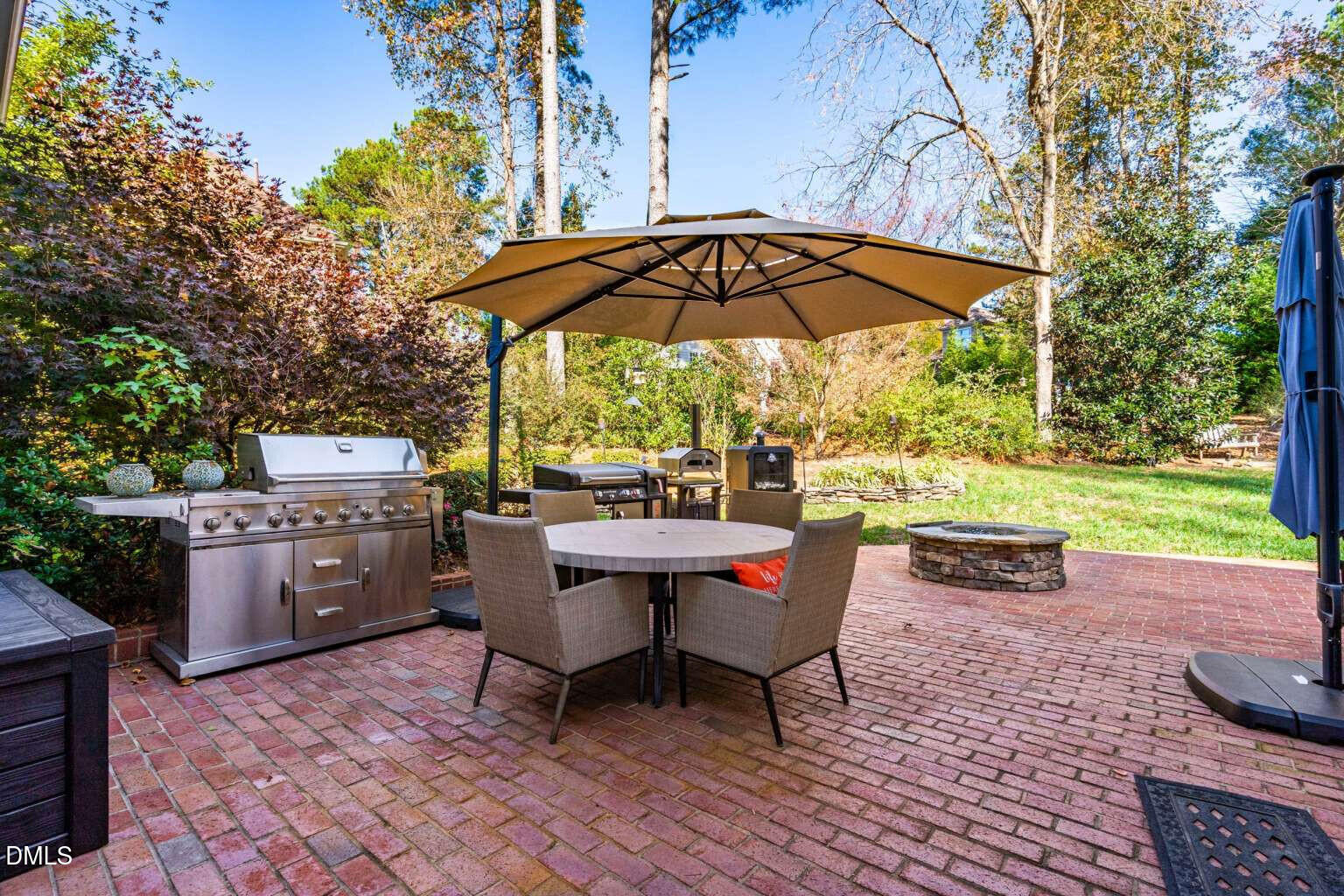 12452 Richmond Run Drive Raleigh, NC 27614 - Photo 60 of 73 a backyard of a house with yard fire pit and outdoor seating