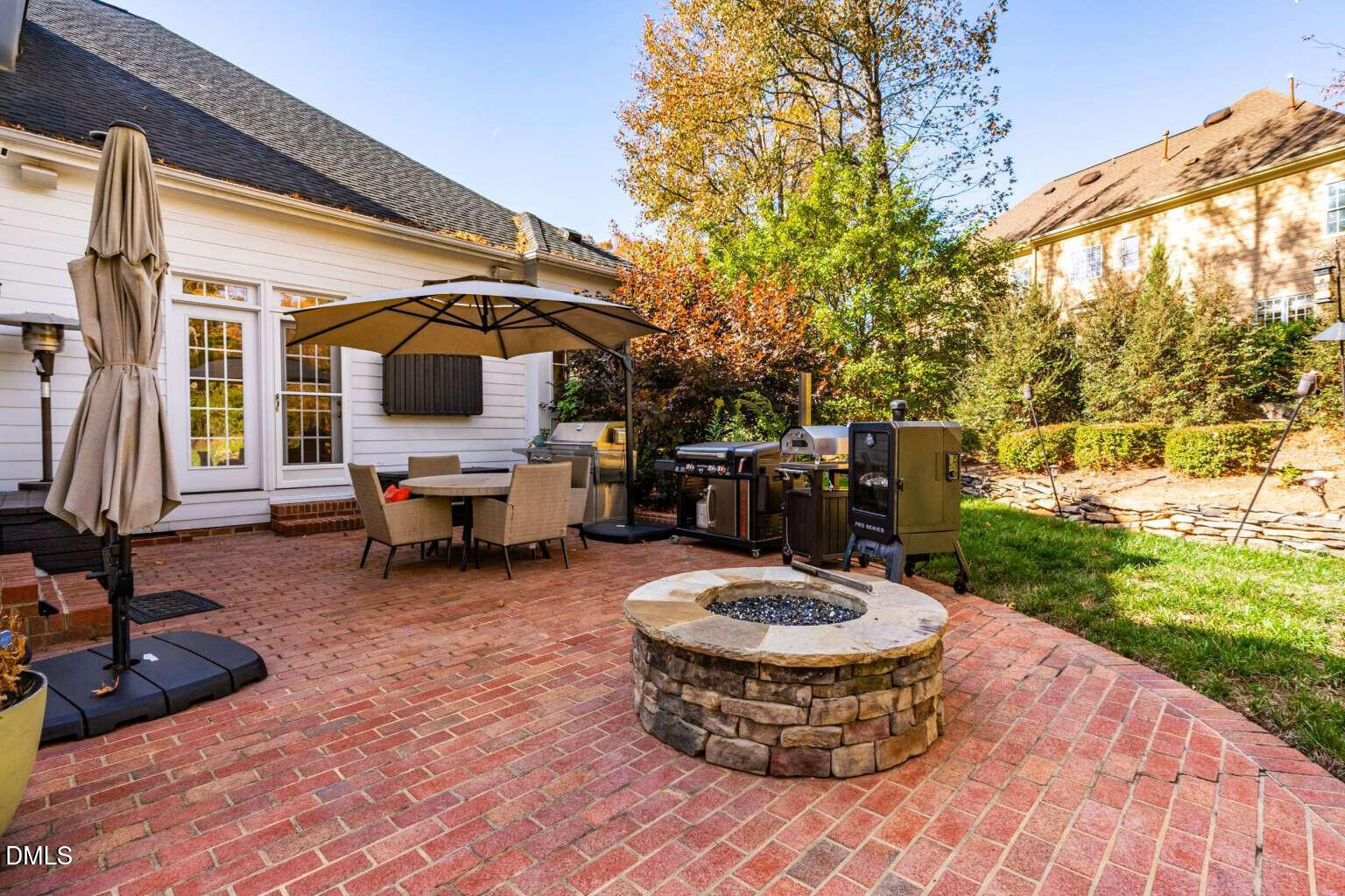 12452 Richmond Run Drive Raleigh, NC 27614 - Photo 61 of 73 a view of a backyard with table and chairs and a barbeque