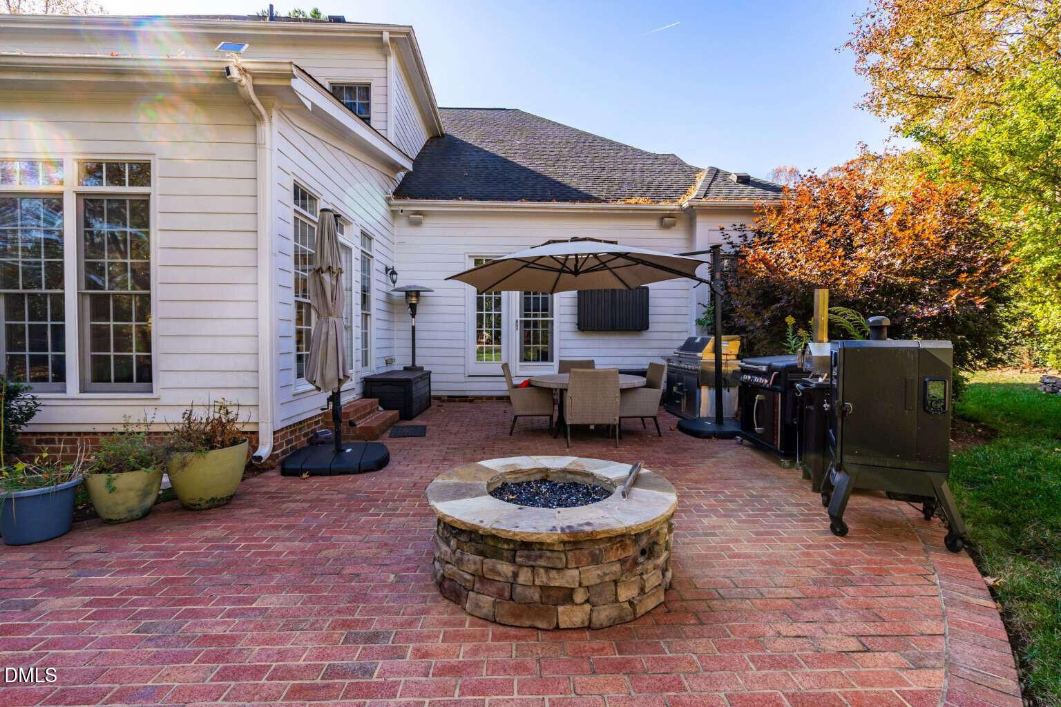 12452 Richmond Run Drive Raleigh, NC 27614 - Photo 64 of 73 a view of a patio with couches chairs and a fire pit