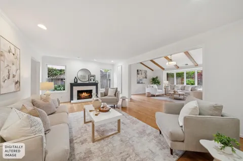 a living room with furniture and a table