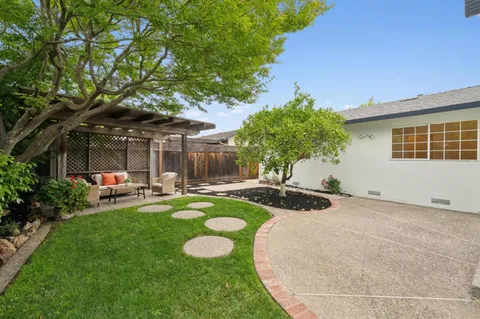 an aerial view of house with yard