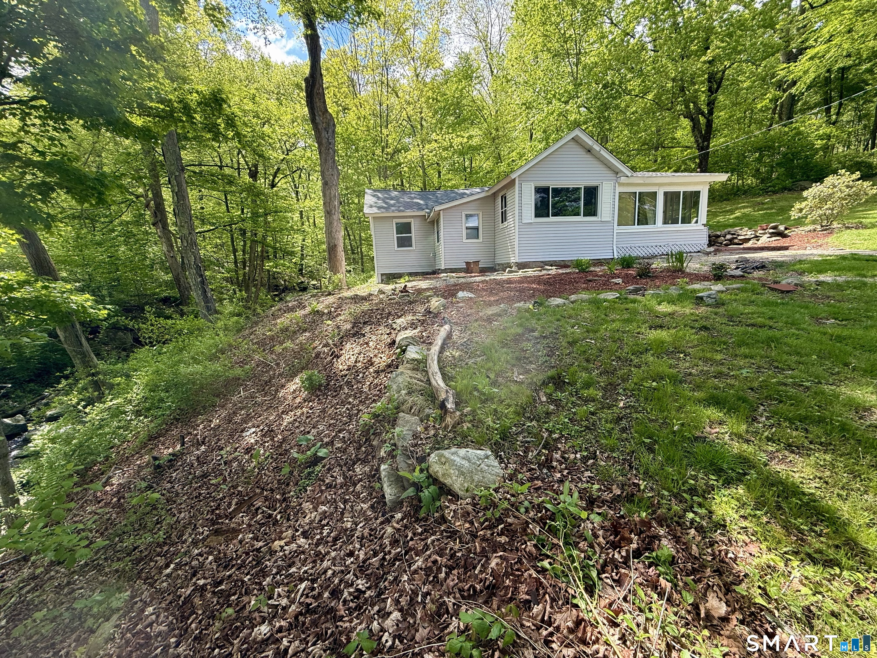 277 Lake Road Andover, CT 06232 - Photo 4 of 18 a view of house with yard and green space