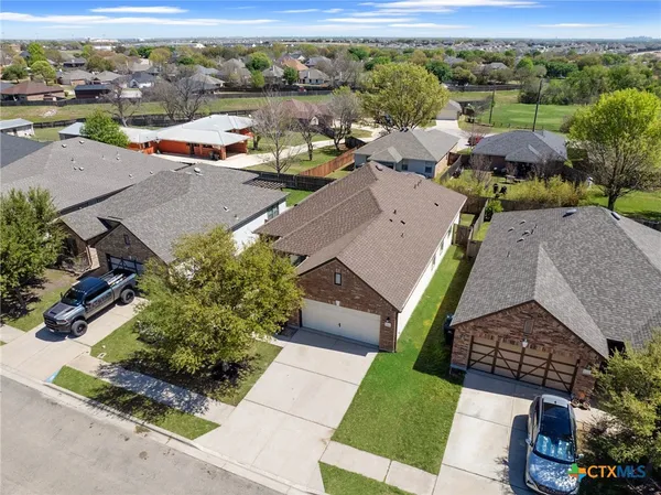 an aerial view of a house with a garden