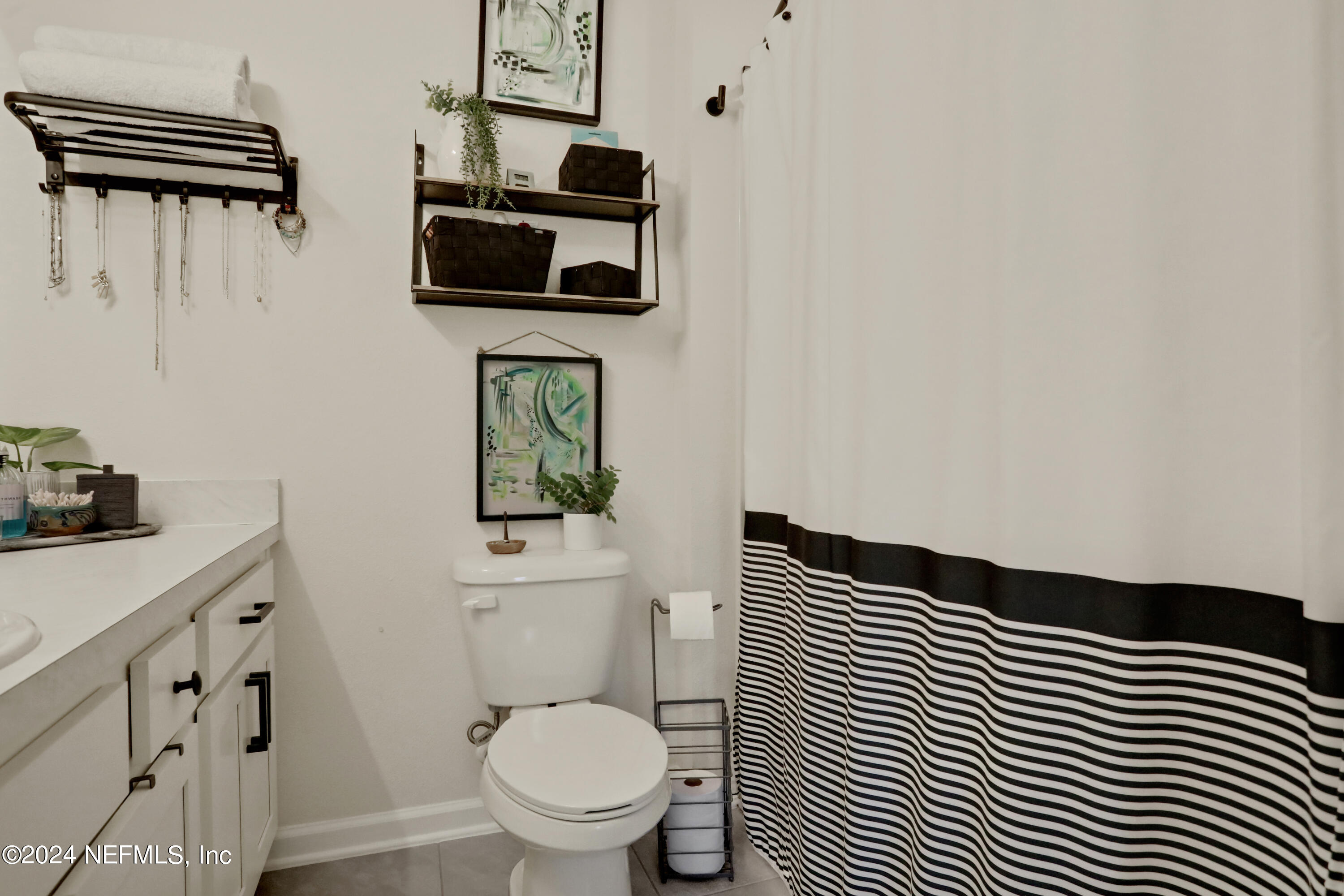854 Rotary Road Jacksonville, FL 32211 - Photo 12 of 32 a bathroom with a toilet and a sink