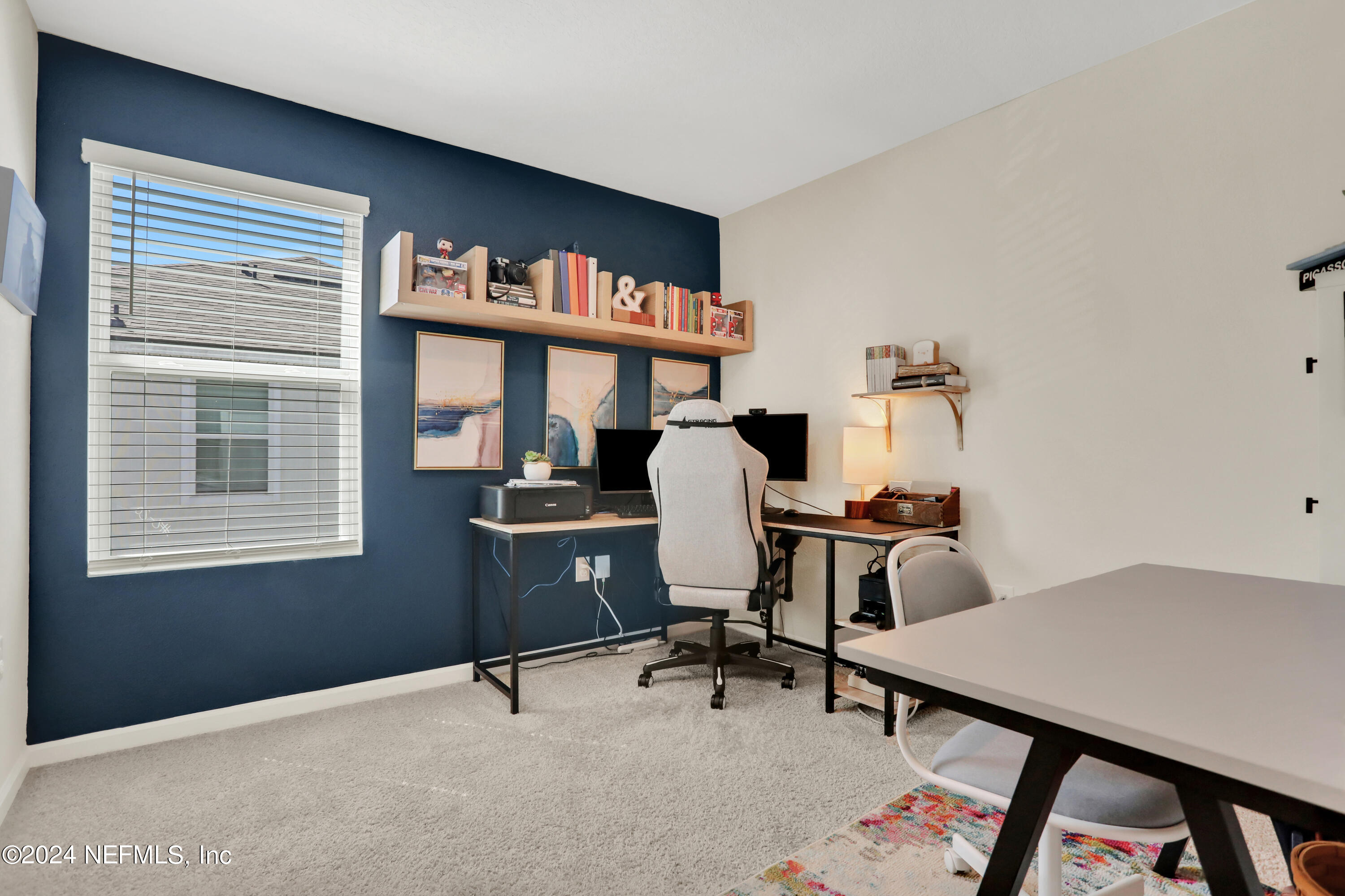 854 Rotary Road Jacksonville, FL 32211 - Photo 13 of 32 a view of a workspace with furniture and a window