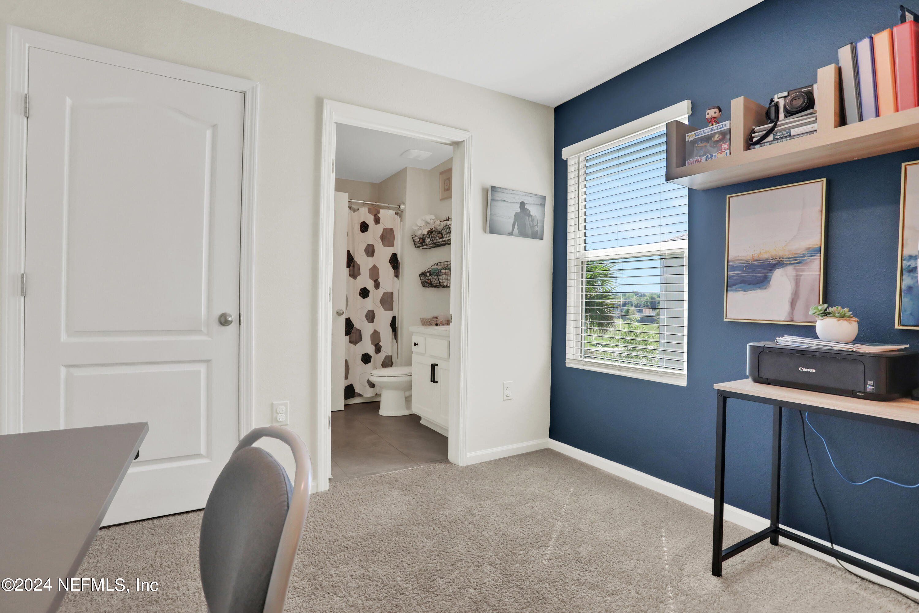 854 Rotary Road Jacksonville, FL 32211 - Photo 14 of 32 a view of a livingroom with workspace and a window