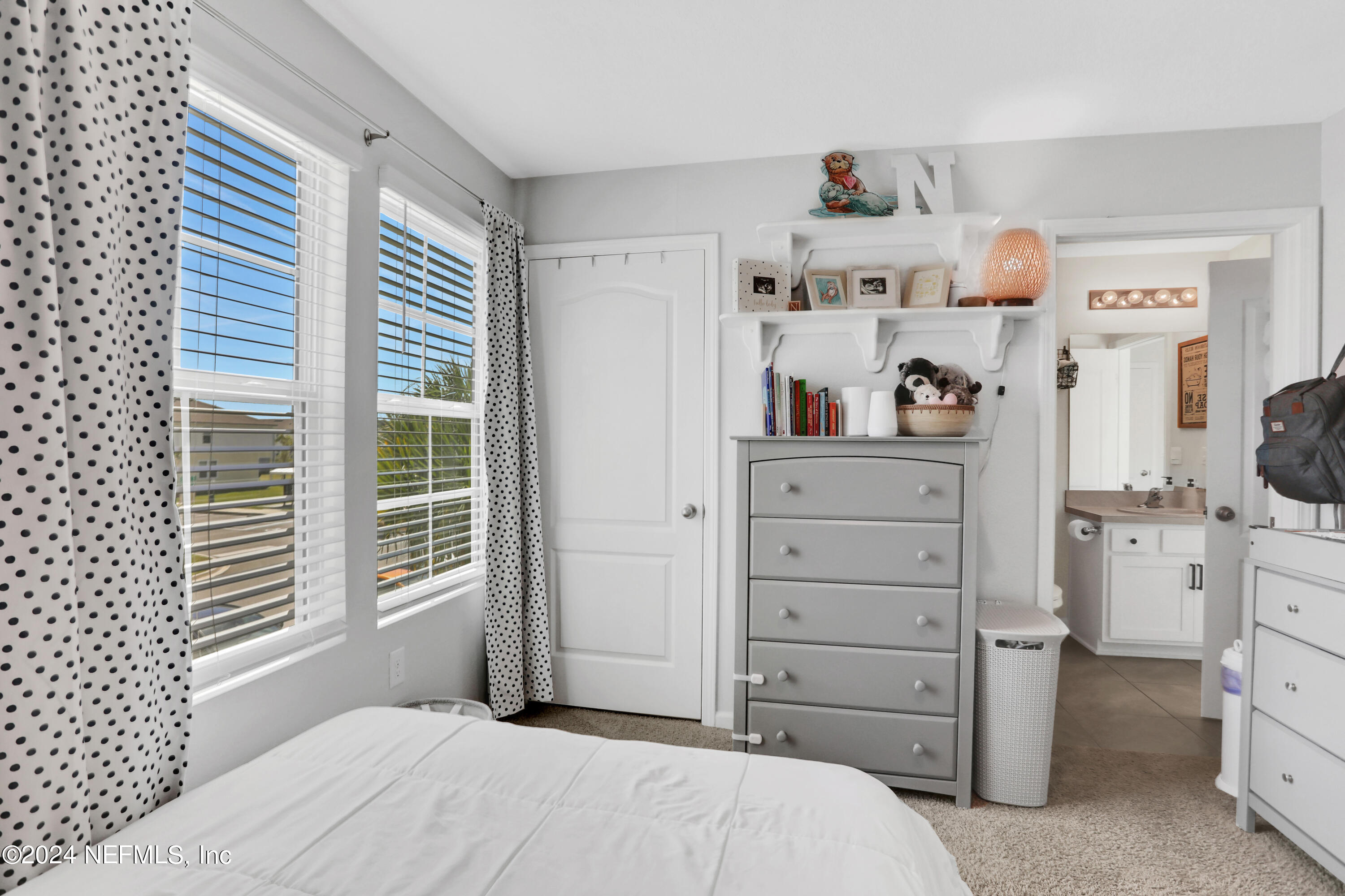 854 Rotary Road Jacksonville, FL 32211 - Photo 17 of 32 a bedroom with a bed and a window