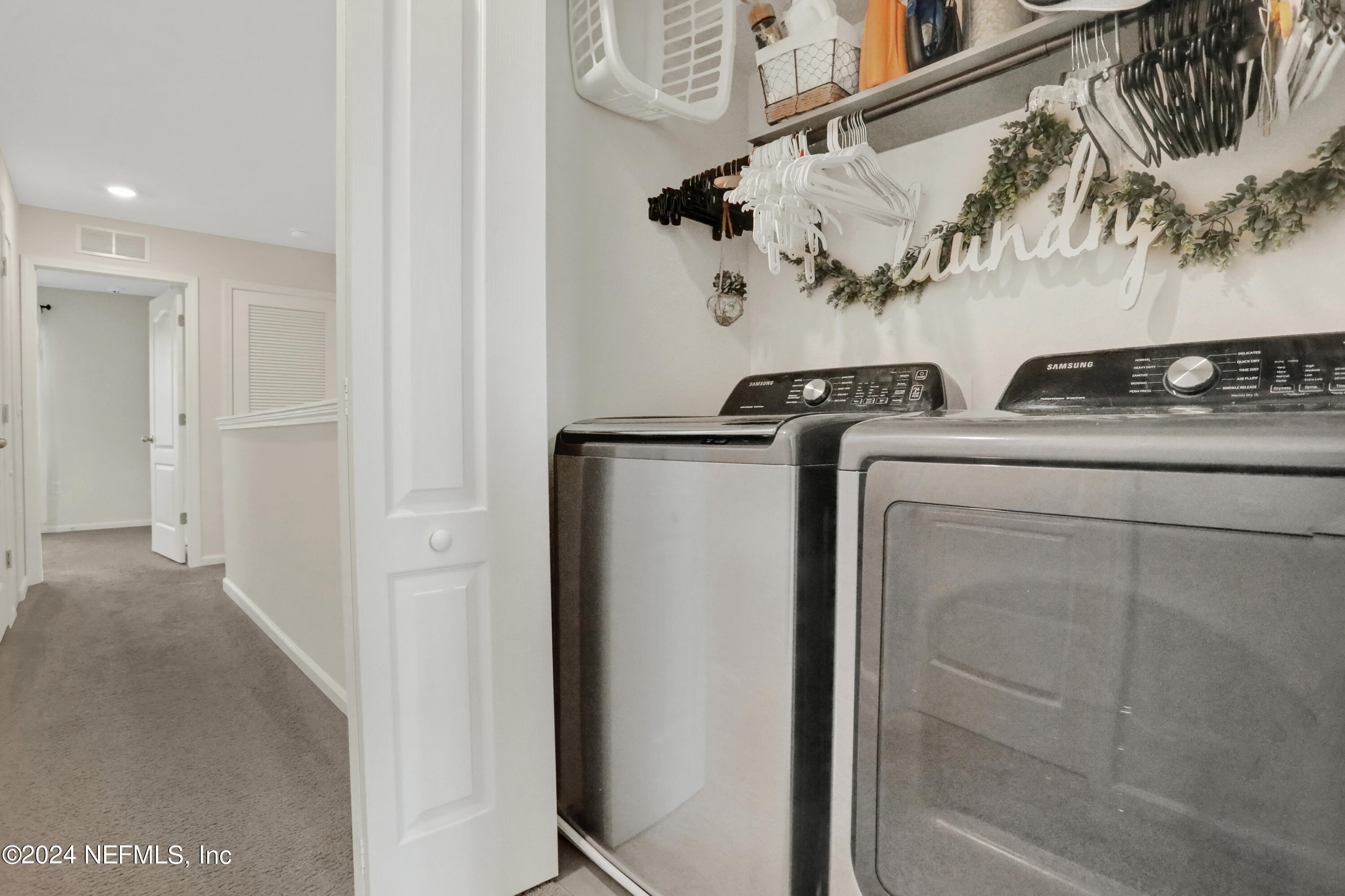 854 Rotary Road Jacksonville, FL 32211 - Photo 19 of 32 a view of storage and utility room with washer and dryer