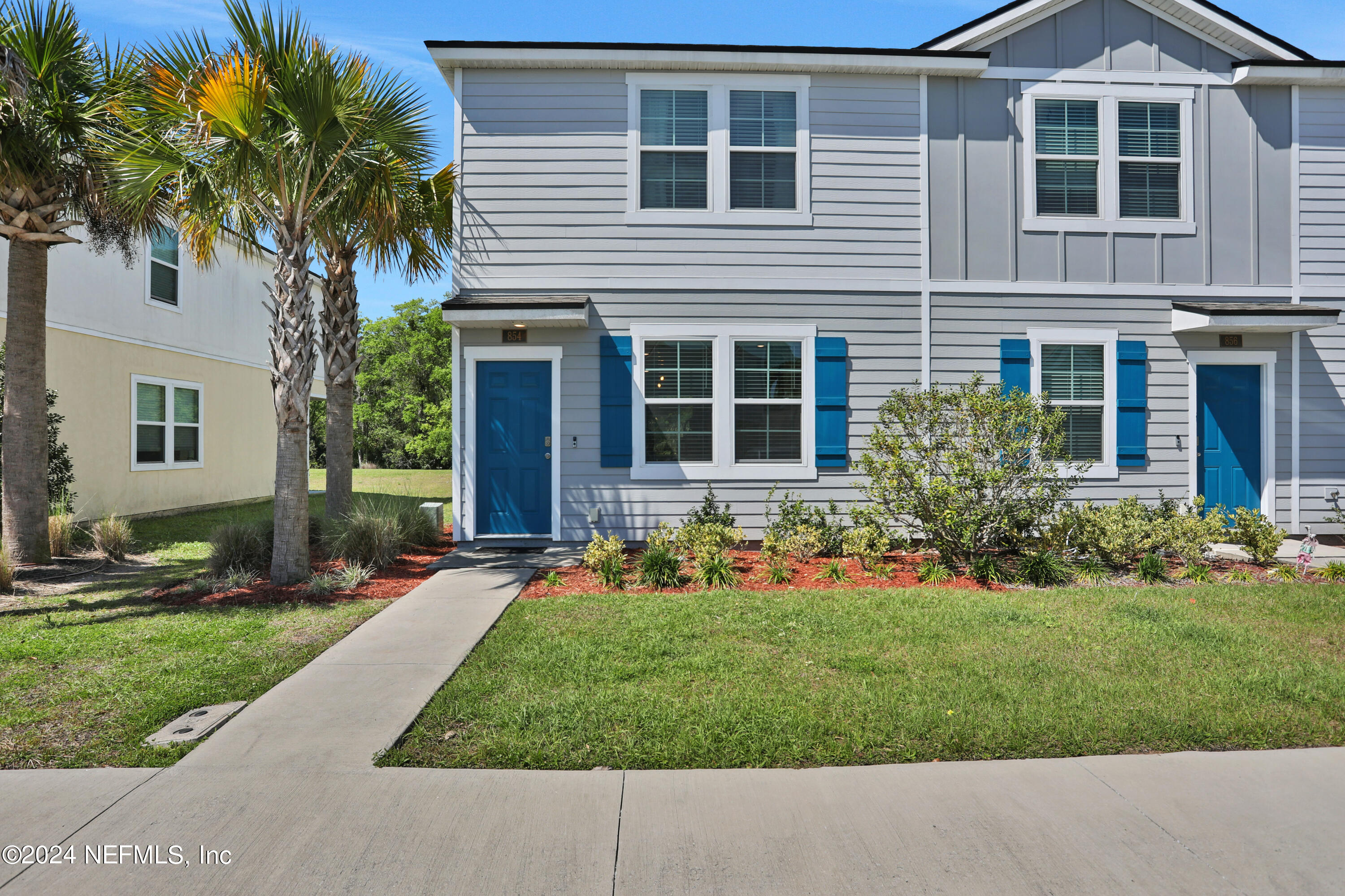 854 Rotary Road Jacksonville, FL 32211 - Photo 23 of 32 a front view of a house with a yard and garage