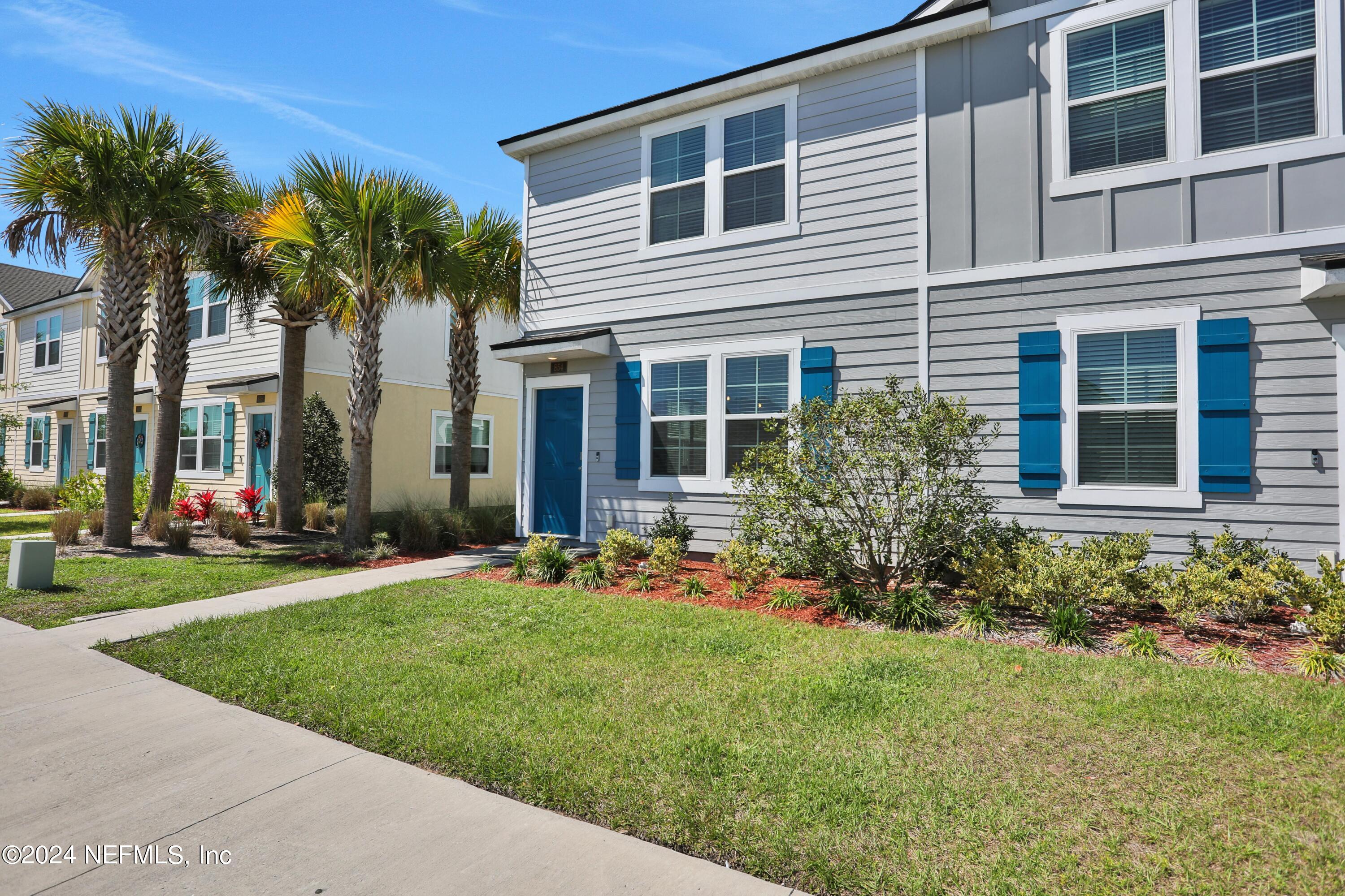 854 Rotary Road Jacksonville, FL 32211 - Photo 24 of 32 a front view of a house with a garden and yard