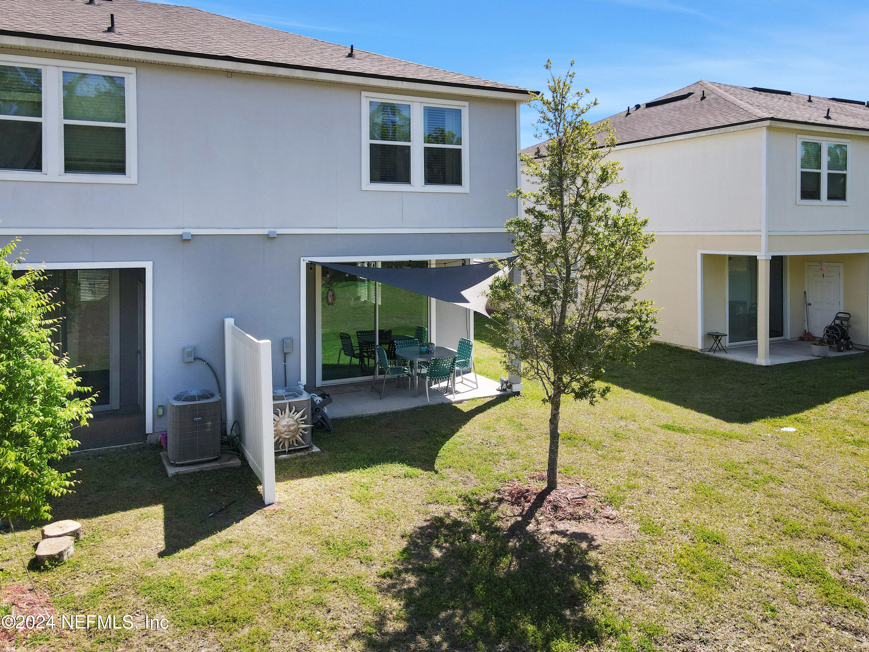 854 Rotary Road Jacksonville, FL 32211 - Photo 32 of 32 a swimming pool with patio outdoor seating and yard