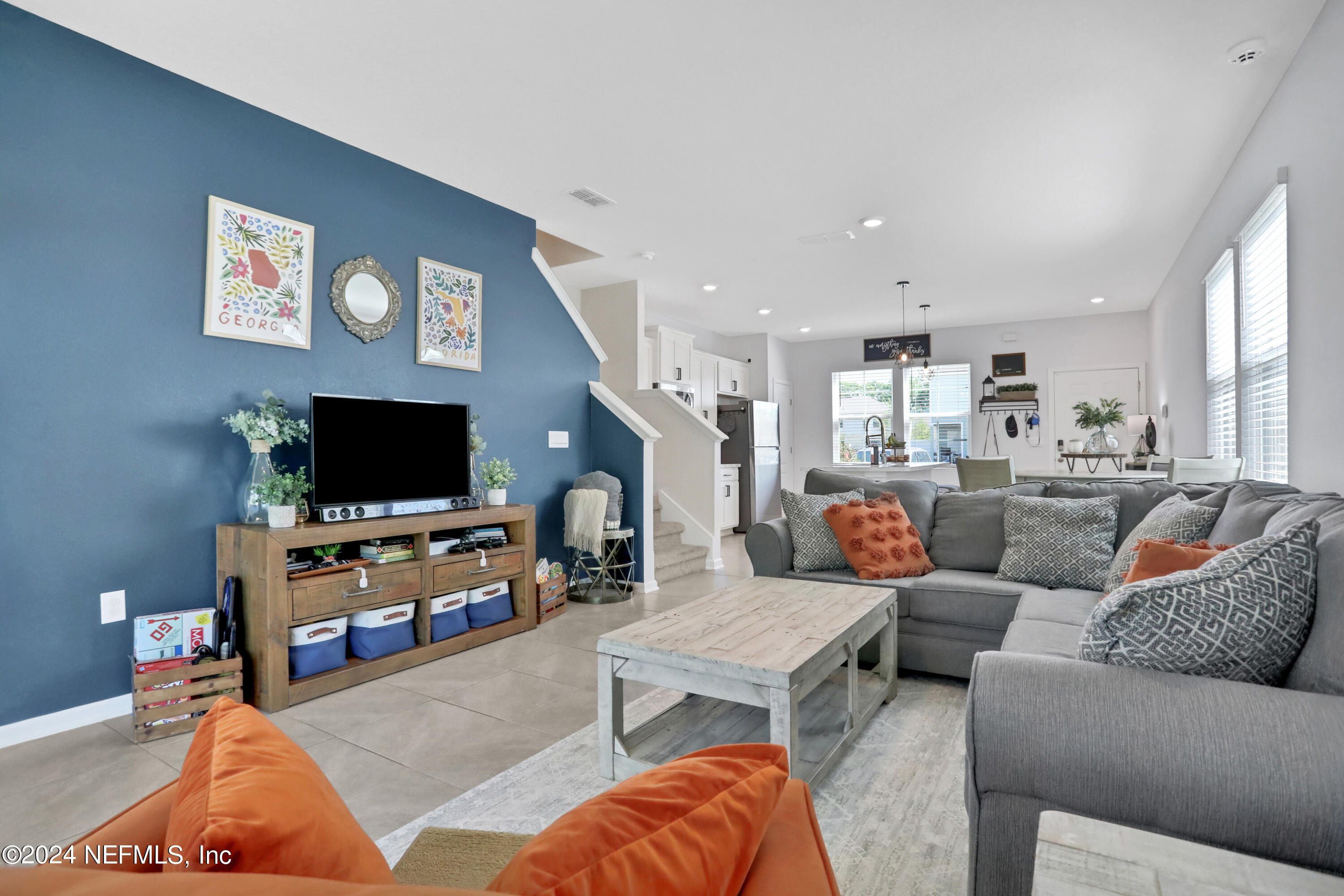 854 Rotary Road Jacksonville, FL 32211 - Photo 5 of 32 a living room with furniture and a flat screen tv