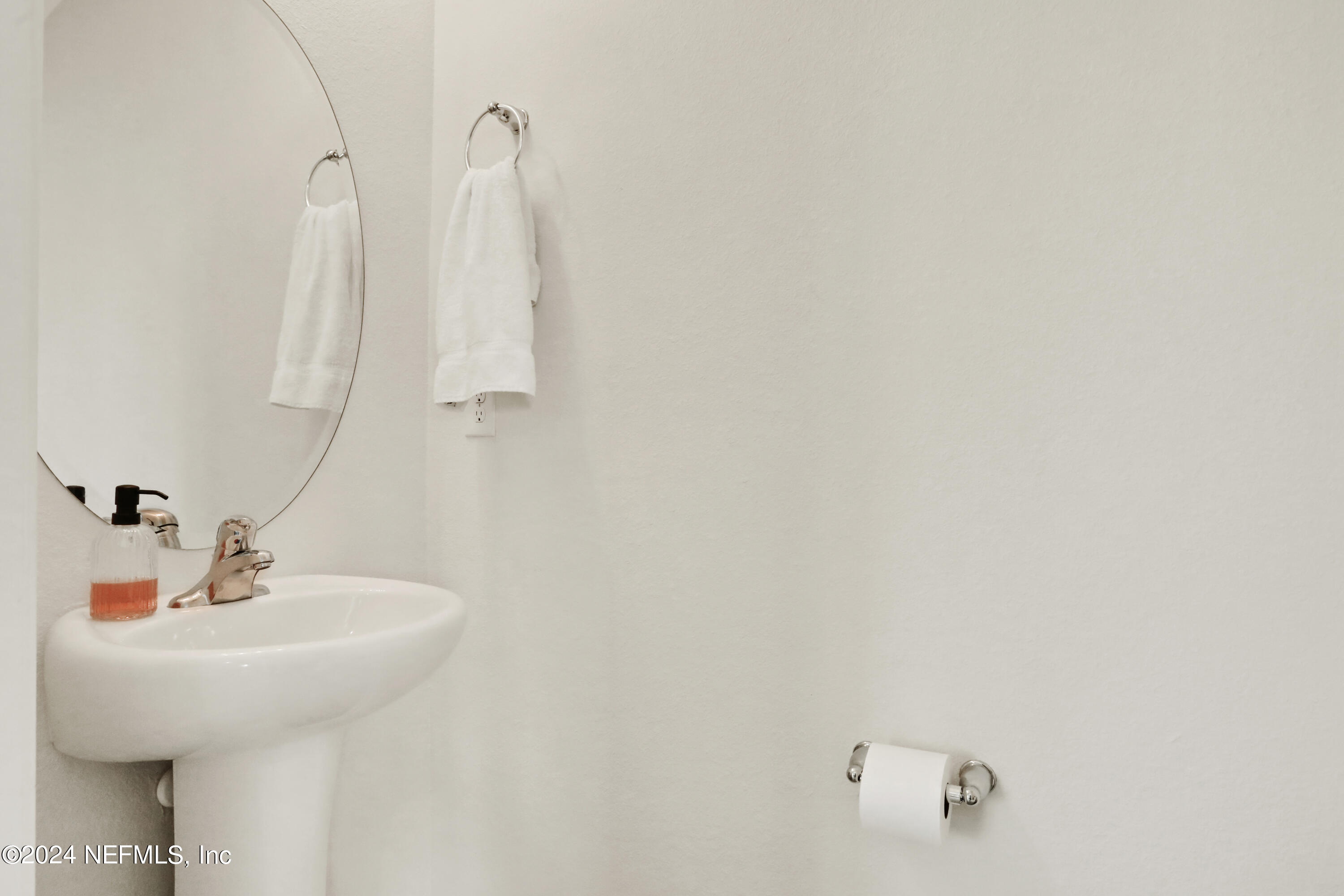 854 Rotary Road Jacksonville, FL 32211 - Photo 8 of 32 a bathroom with a sink and mirror