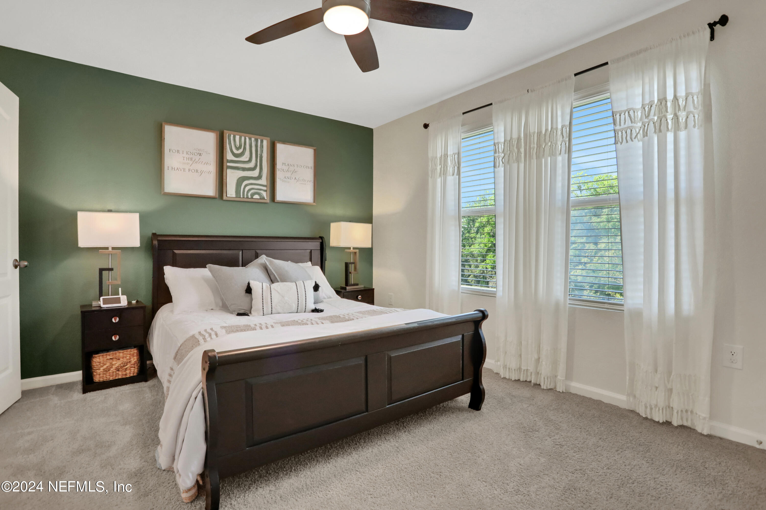 854 Rotary Road Jacksonville, FL 32211 - Photo 9 of 32 a bedroom with a bed and a chandelier