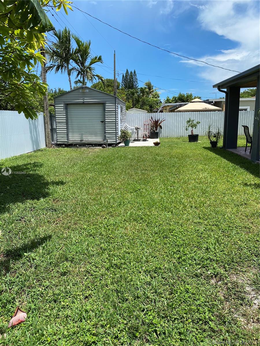 7565 Southwest 28th Street Road Miami, FL 33155 - Photo 14 of 31 a front view of a house with garden