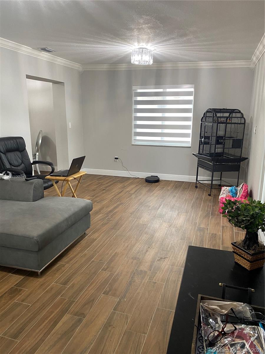 7565 Southwest 28th Street Road Miami, FL 33155 - Photo 25 of 31 a living room with furniture and a potted plant