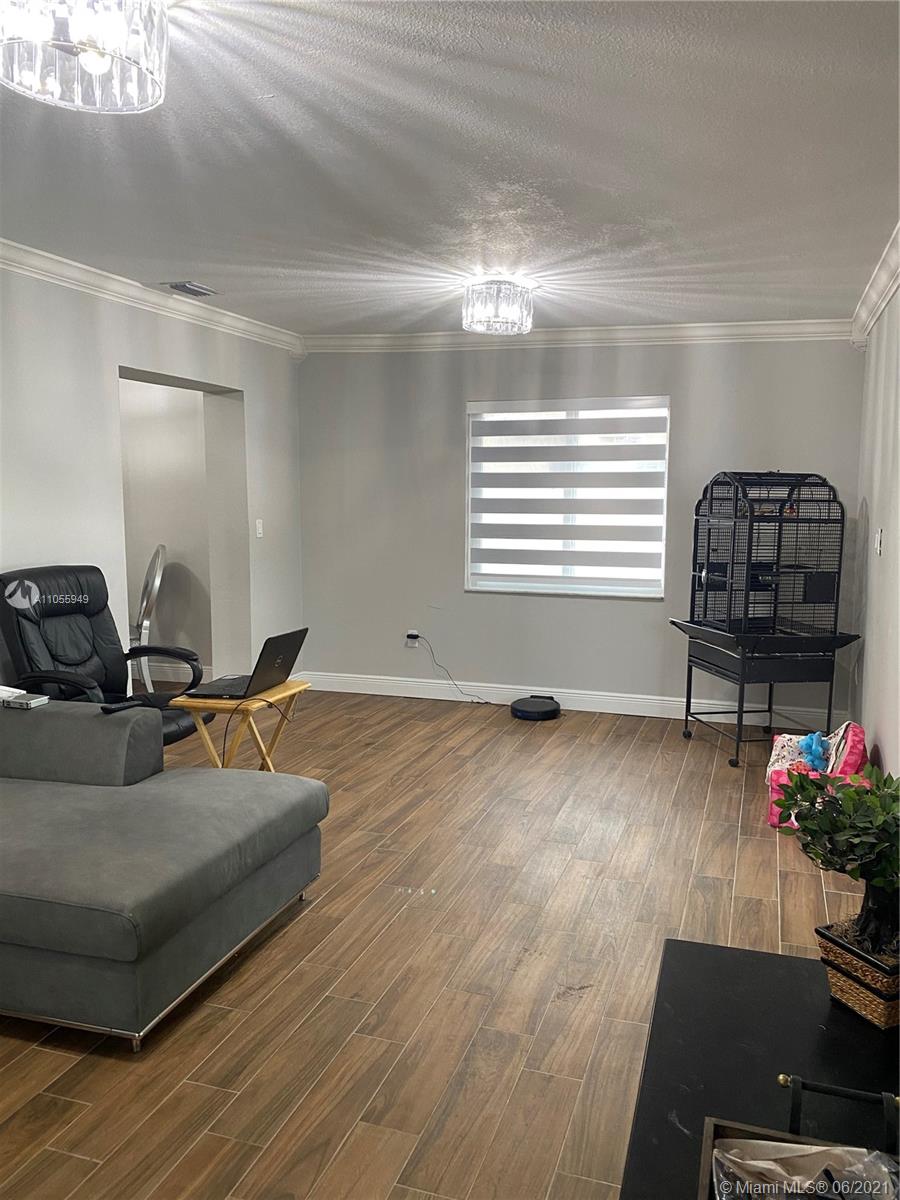 7565 Southwest 28th Street Road Miami, FL 33155 - Photo 26 of 31 a living room with furniture and a window