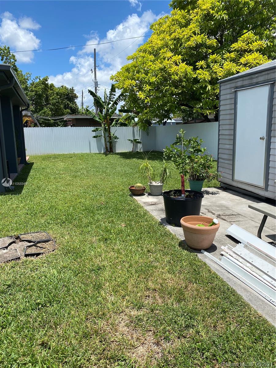 7565 Southwest 28th Street Road Miami, FL 33155 - Photo 7 of 31 a view of a backyard with potted plants