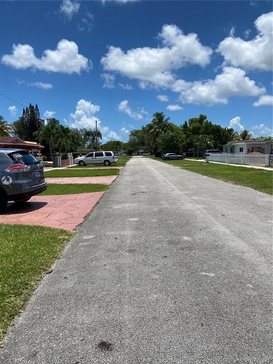 7565 Southwest 28th Street Road Miami, FL 33155 - Photo 8 of 31 a view of a street with houses