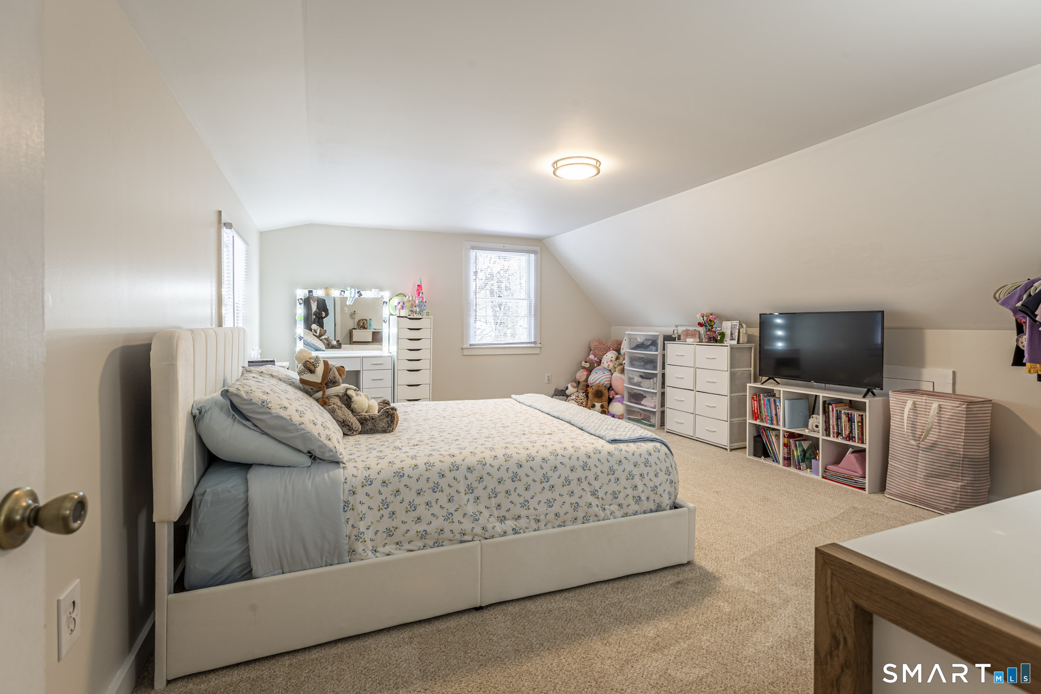 429 Lakeside Road Morris, CT 06763 - Photo 12 of 38 a bedroom with a bed and a flat screen tv