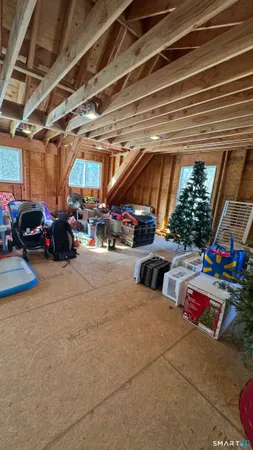 a bedroom with bed and a window