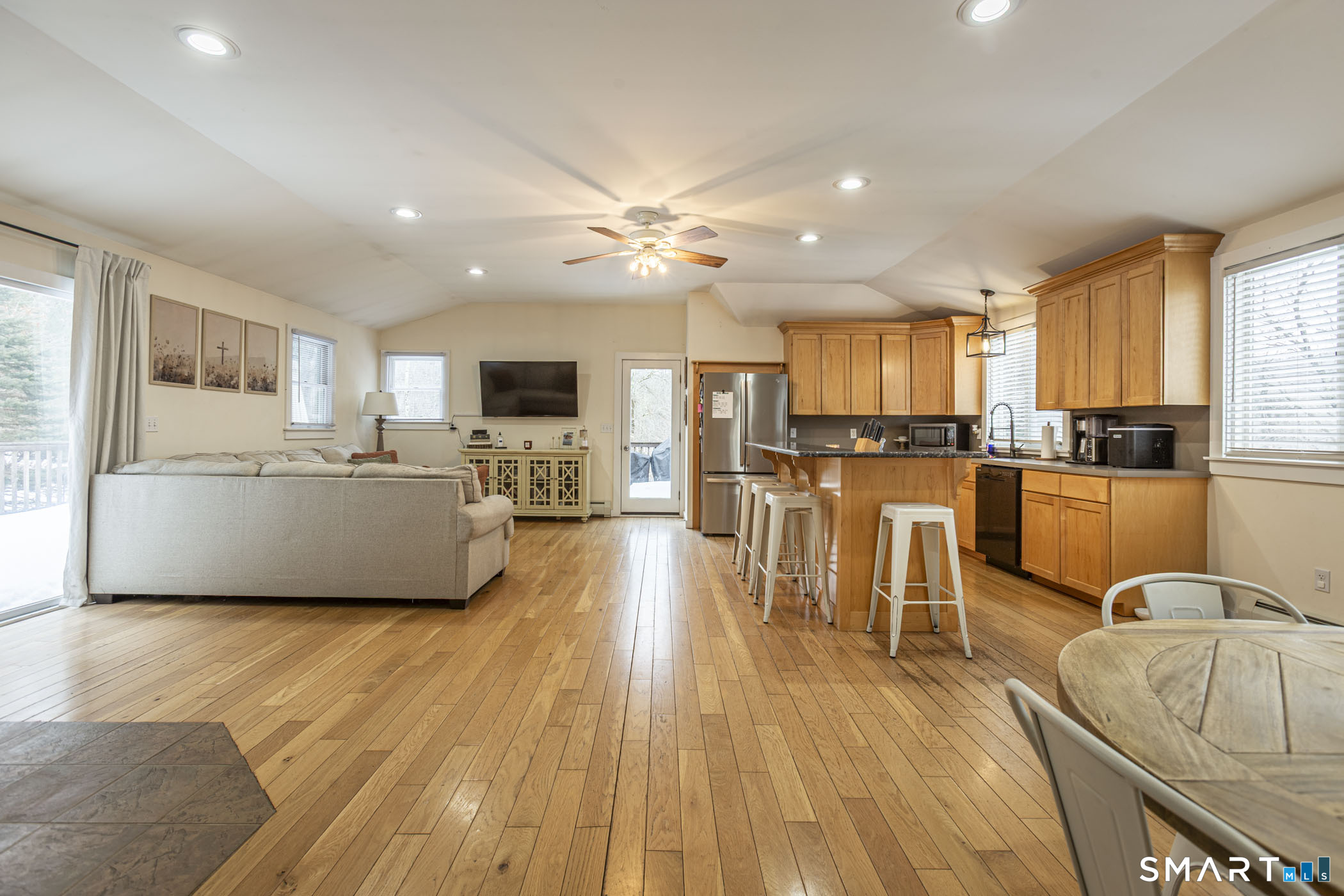 429 Lakeside Road Morris, CT 06763 - Photo 18 of 38 a living room with stainless steel appliances granite countertop furniture wooden floor and a kitchen view