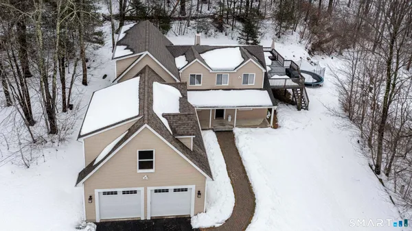 a view of a white house with a yard