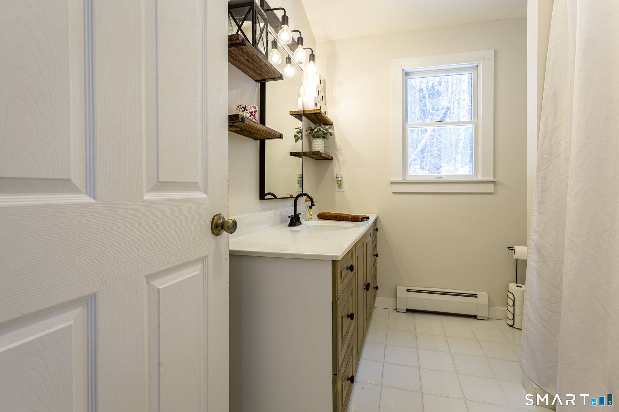 429 Lakeside Road Morris, CT 06763 - Photo 21 of 38 a bathroom with a sink a vanity and a mirror