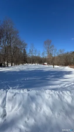 a bedroom with a bed and lamp