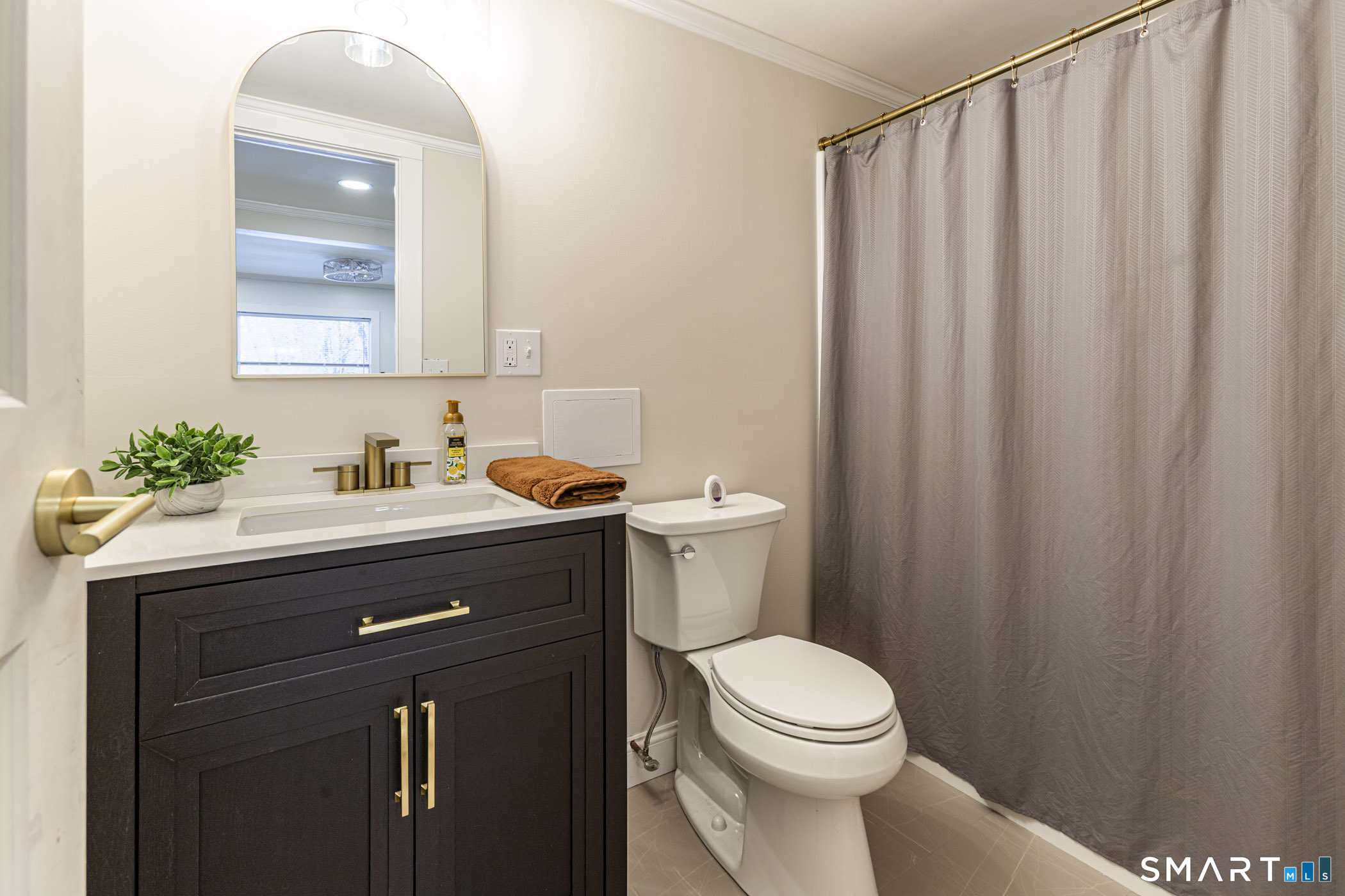 429 Lakeside Road Morris, CT 06763 - Photo 31 of 38 a bathroom with a sink a toilet and shower curtain