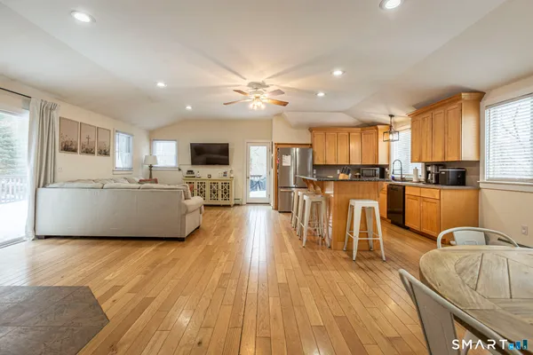 a spacious bedroom with a bed and a chandelier